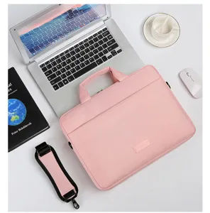 Bolso para laptop rosa con asa y correa, elegante maletin casual para trabajo y oficina.