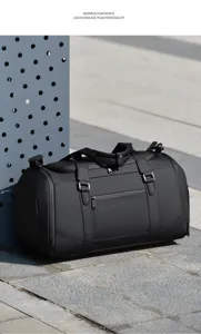 Detailed outdoor view of black multifunctional travel duffel bag with shoe compartment.