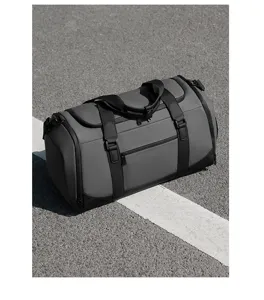 Close-up detail of the grey multi-functional sports gym duffel bag with black straps and zip.