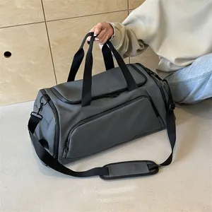 Large capacity sports fitness duffel bag in dark grey with shoulder strap for travel.
