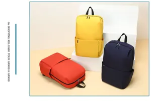 Detailed view of casual minimalist backpacks in yellow, blue and red colors displayed neatly.