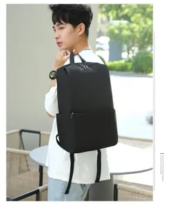 Minimalist casual black backpack for men and women, lightweight daily school book bag with pocket.