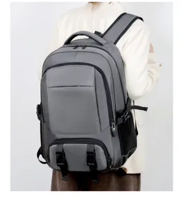 Detail view of large capacity grey travel backpack worn on back, multi-functional design.
