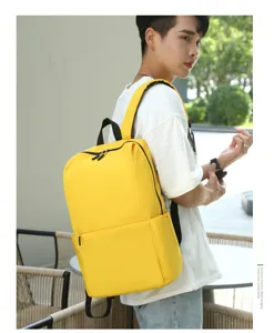 Casual yellow lightweight backpack for men and women, simple daily school and travel bag.