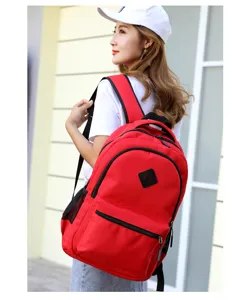 Red casual student backpack detail view, large capacity daily outdoor travel bag design.