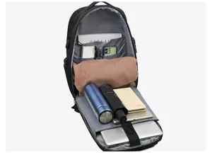 Detailed view of a 15.6 inch black anti theft laptop backpack with multiple internal compartments.