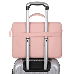 Pink laptop sleeve with luggage strap, perfect for travel and business commutes daily use.