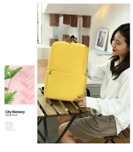 Close-up detail of the stylish yellow casual backpack showing fine stitching and smooth zippers.