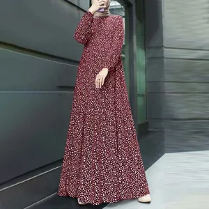 Detailed view of the women's long-sleeve round-neck printed retro maxi dress in burgundy.