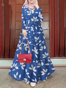 Detailed view of the blue leaf print long sleeve maxi dress featuring an adjustable waist belt.