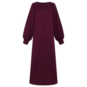Detailed view of the burgundy long sleeve sweatshirt dress, showcasing cozy fabric and cuffs.