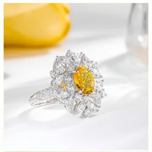 Close-up detail of a stunning oval yellow sapphire ring surrounded by sparkling white CZ stones.
