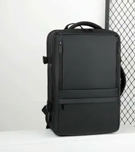 Detail view of the black business backpack showing multi-compartment design and durable fabric.