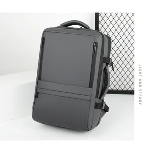 Grey business travel backpack detail, expandable waterproof laptop bag for commute use.