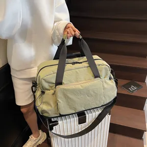 Lightweight travel bag large capacity duffel bag short trip shoulder luggage for women.