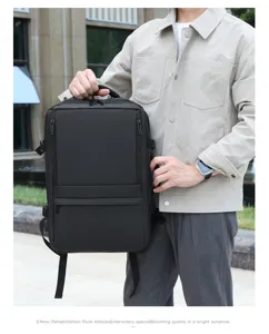 Outdoor detail view of a black business backpack, durable fabric, multi-pocket design.