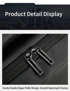 Close-up detail shot of the durable black backpack dual zipper pullers showing sturdy construction.