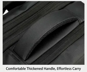 Close-up detail of the durable thickened handle on the black business laptop backpack.