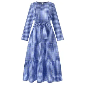 Detailed view of the blue and white checkered long sleeve tiered maxi dress with waist belt.
