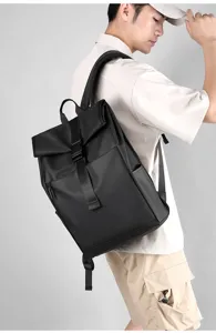 Stylish men's roll-top black backpack, large capacity casual daypack worn by model.