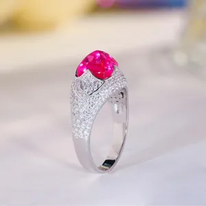 Exquisite lab-grown pink sapphire sugarloaf ring in 925 sterling silver with sparkling pavé stones.