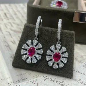 Elegant sterling silver ruby and cubic zirconia sunburst cluster drop earrings for women.