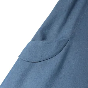 Blue denim pinafore dress pocket main view showing vintage casual long skirt fabric detail.