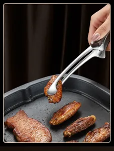Stainless steel food tong with wood handle for kitchen BBQ, grilling, and buffet use.