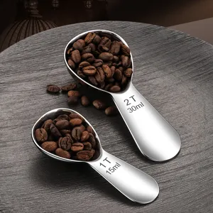 Stainless steel measuring spoon set with volume scales for coffee beans, powder, and oatmeal usage.
