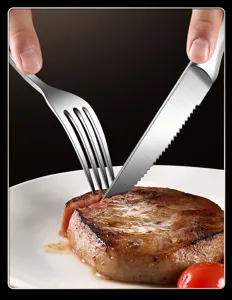 Stainless steel steak knife and fork set detail showing serrated blade cutting meat.