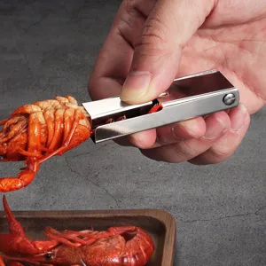 Stainless steel crawfish peeler tool, easy lobster shell opener for seafood dining experience.