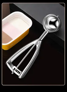 Stainless steel ice cream scoop detail, spring loaded trigger melon baller fruit spoon.