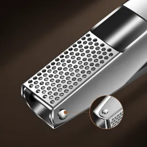 Stainless steel garlic press manual kitchen garlic masher tool with fine round holes.