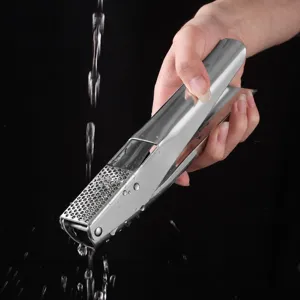 Stainless steel garlic press manual kitchen tool for home cooking and easy garlic mincing.