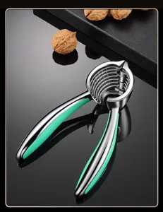 Stainless steel nutcracker tool detail view showing teeth and green ergonomic handle grip.