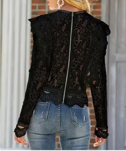 Black lace long sleeve top detail showcasing hollow floral pattern and back zipper.