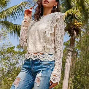 Stunning white lace crochet crop top with long sleeves, elegant and chic for summer style.