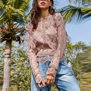 Chic pink lace long sleeve top with hollow out details, perfect for stylish outdoor looks.