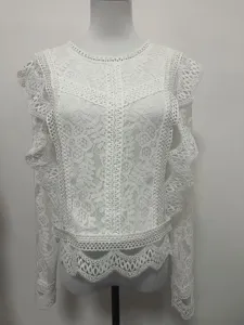 White lace long-sleeve crop top for women, featuring hollow-out floral lace and stylish design.
