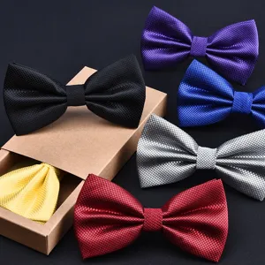 Detailed view of assorted multi-color textured bow ties set with classic grid pattern for men.