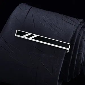 Men's silver metal tie clip with black enamel detail and geometric stripes for suit.