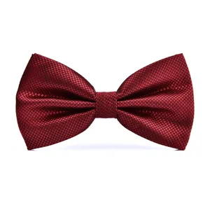 Wine red bow tie detail view, elegant textured pattern for wedding and formal events.