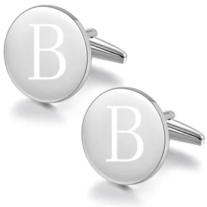 Close-up of round silver metal cufflinks with engraved letter B for men formal business shirts.