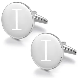 Detailed shot of silver-tone round initial cufflinks, polished finish and engraved letter I.