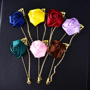 Colorful satin rose lapel pin with gold chain leaf detail, perfect for wedding suit decoration.