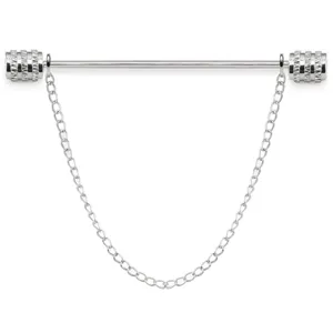 Detailed view of silver tone metal collar pin with delicate hanging chain tassel.