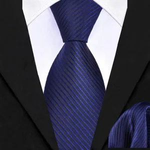 Close up detail of men business navy blue striped necktie and matching pocket square.