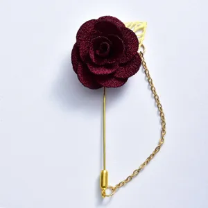 Burgundy fabric rose lapel pin with gold chain and leaf, elegant wedding groom suit brooch.