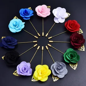 Broche rose en tissu coloree avec tige dore pour decoration de costume de mariage