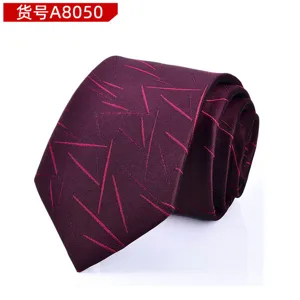 Detail view of a burgundy men's tie featuring abstract geometric line patterns, elegant style.